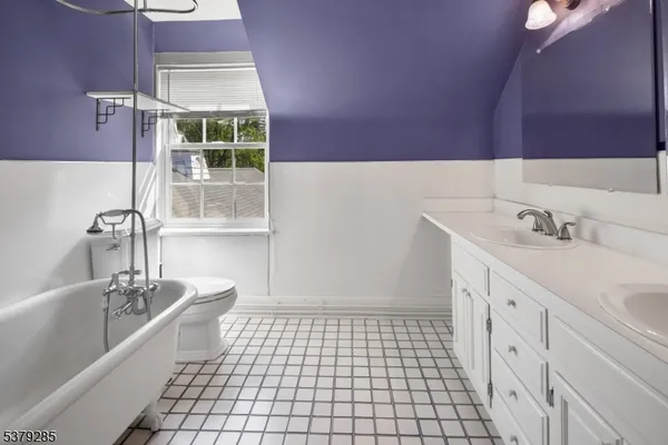 a bathroom with a sink a vanity and a bathtub