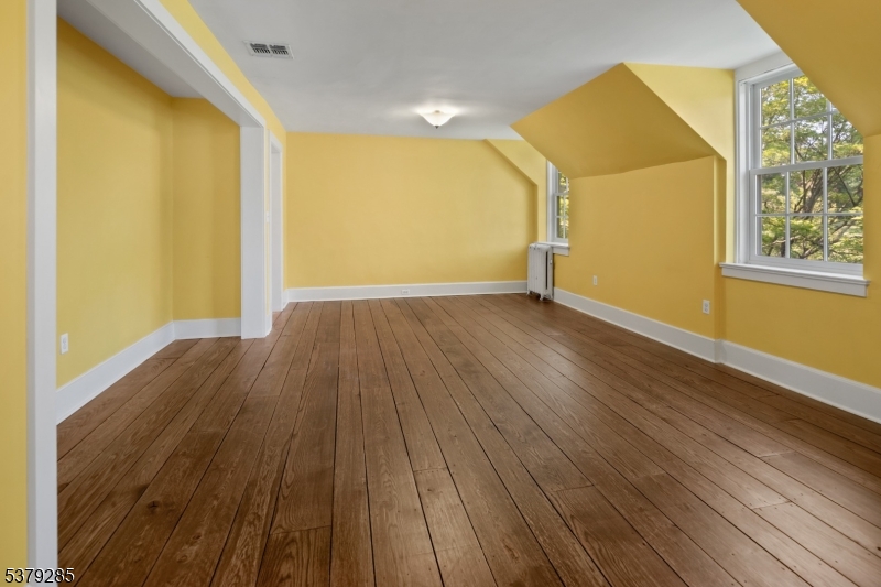49 Liberty Corner Road Bernards, NJ 07931 - Photo 48 of 50 a view of empty room with wooden floor