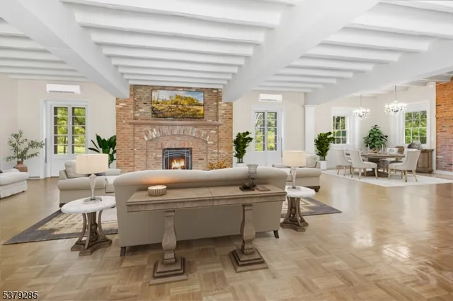 a living room with fireplace furniture and a fireplace