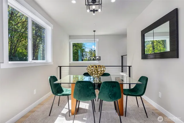 a living room with furniture a fireplace a flat screen tv and a large window