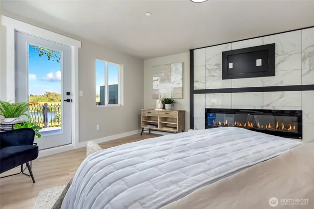 a spacious bedroom with a bed and a fireplace
