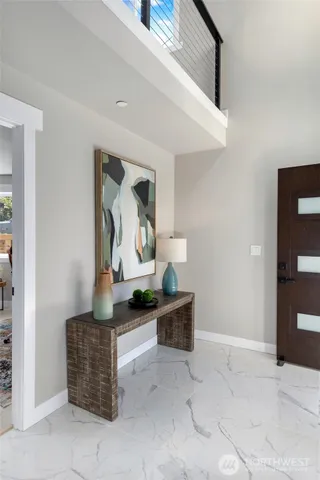 a view of a workspace with furniture and a living room