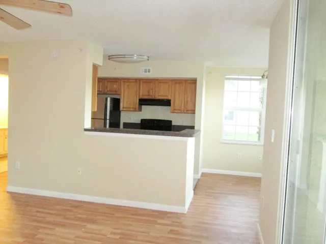 a view of a kitchen from a hallway