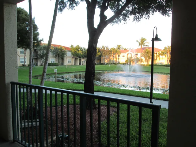 a view of outdoor space with deck and trees
