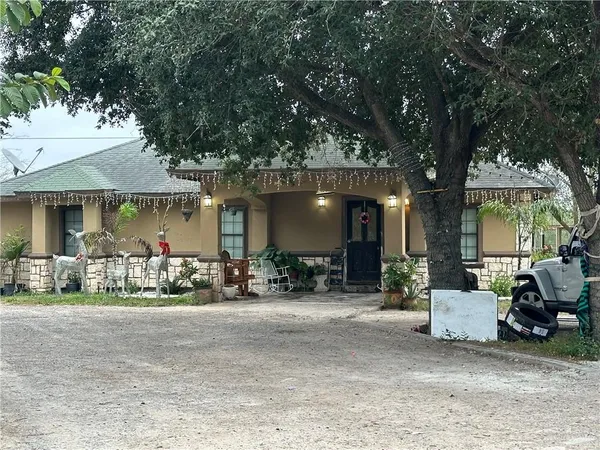 a view of a house with sitting area and furniture