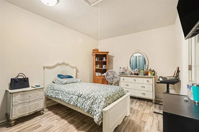 a bedroom with a bed and furniture