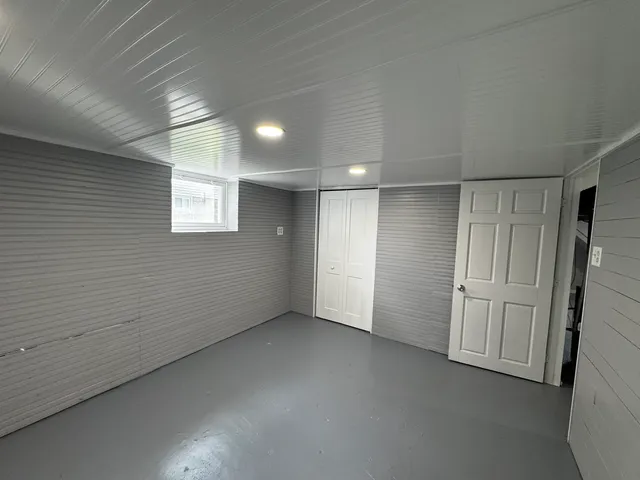 en empty room with windows