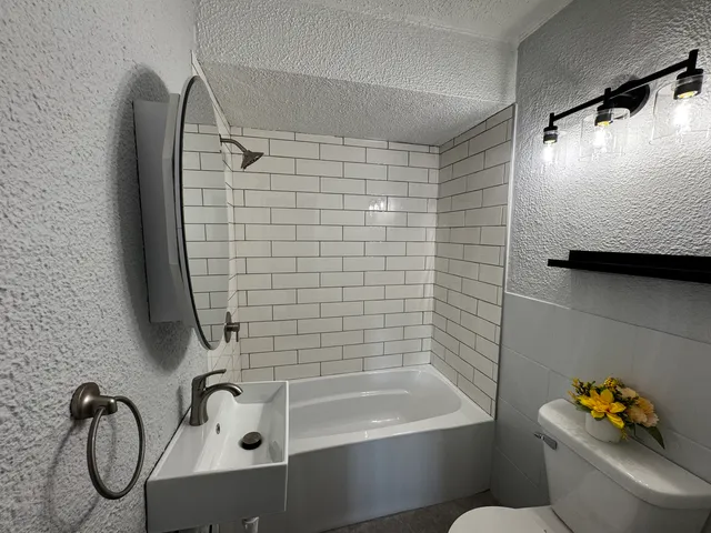 a bathroom with a shower and a tub