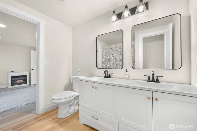 a view of a small space with wooden floor and a window