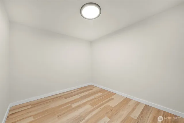 a living room with furniture a flat screen tv and a table