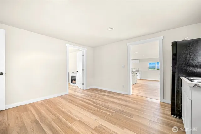 a bedroom with a bed and a painting