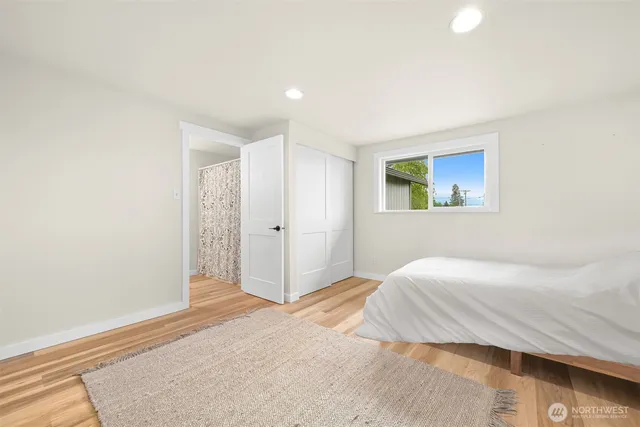 a bedroom with a bed and a fireplace