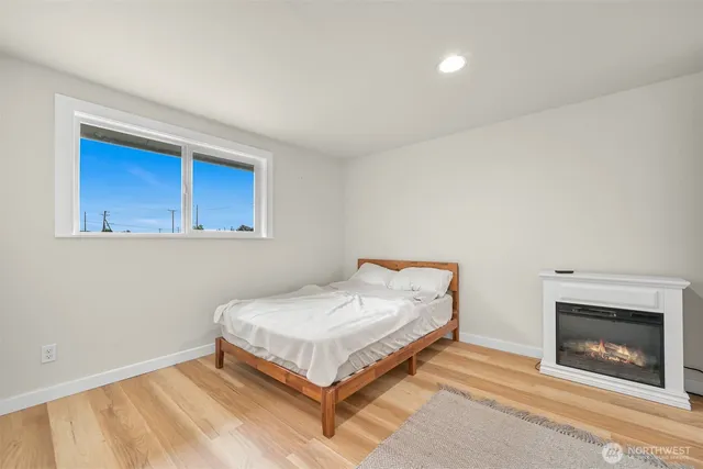 a view of washer and dryer with bathroom in the background