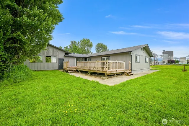 a view of a deck with wooden floor and bench