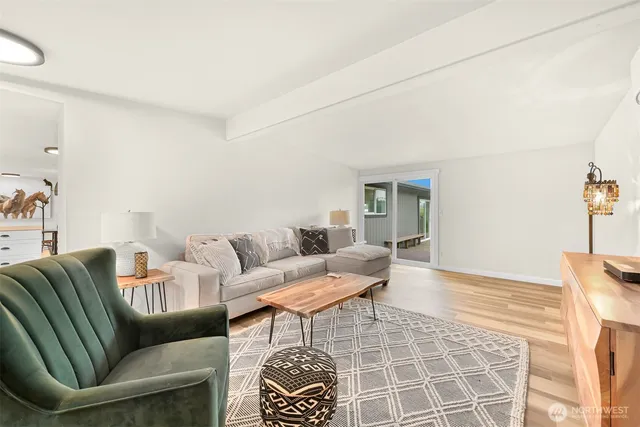 a living room with furniture and a rug