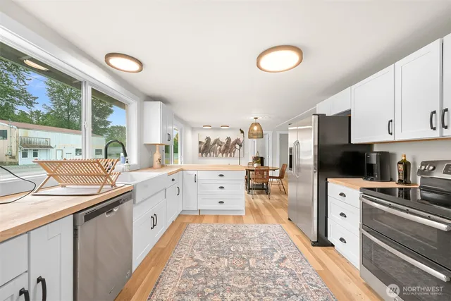 a view of a dining room with furniture window and outside view
