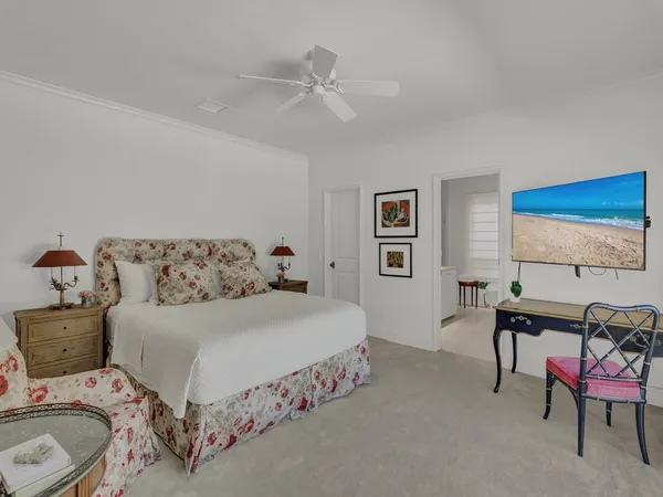 a bed room with two bed and a large window