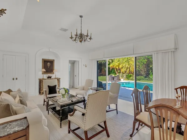 a kitchen with granite countertop a refrigerator and a stove top oven