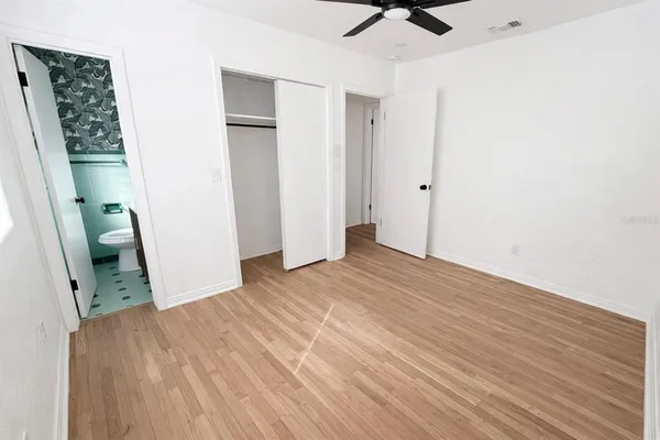 a bathroom with a sink mirror and toilet