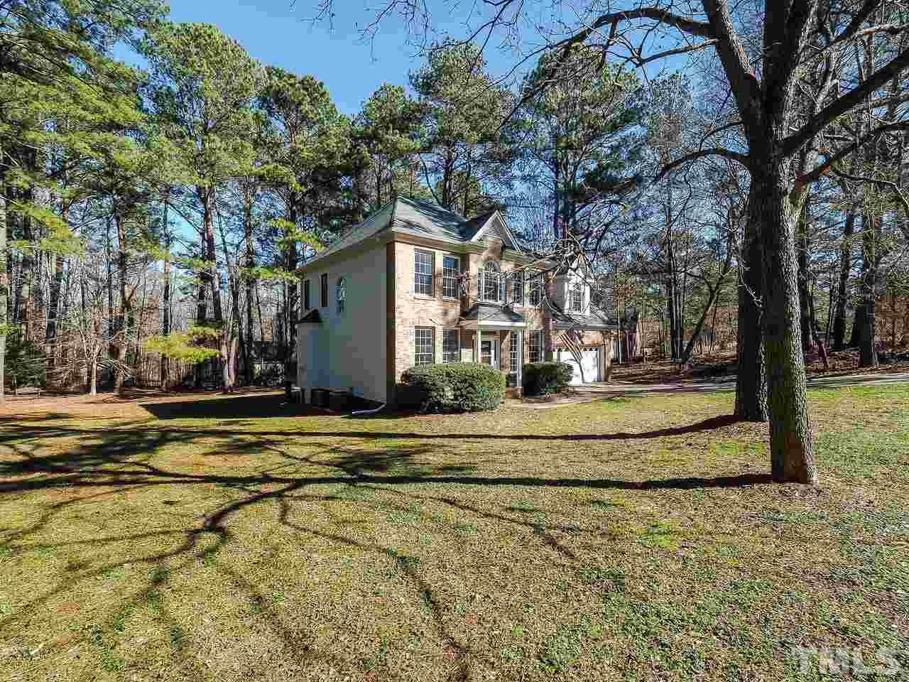 208 Priceview Drive Raleigh, NC 27603 - Photo 3 of 25 a view of a house with large trees