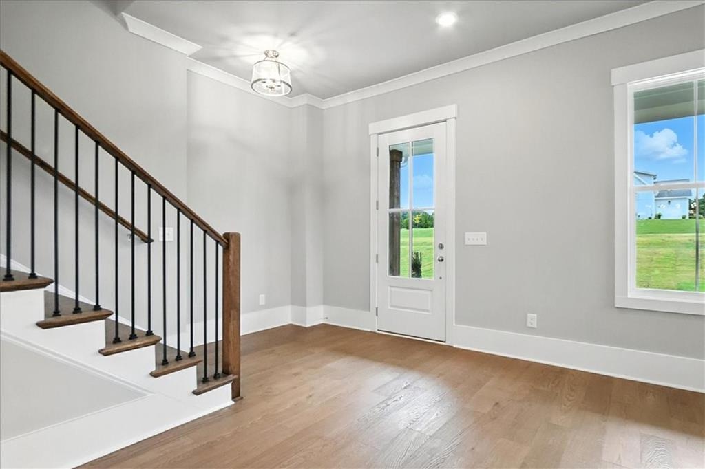 95 Old Town Road Dacula, GA 30019 - Photo 14 of 74 wooden floor in an empty room with a window
