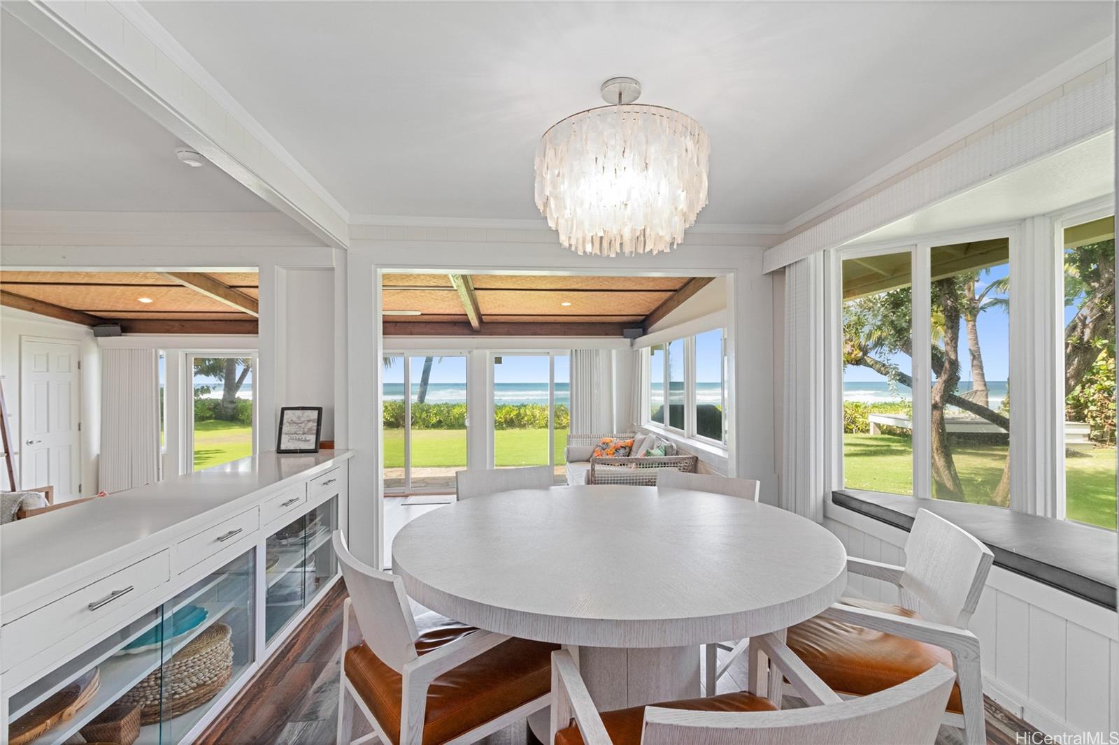 61-707 Papailoa Road Haleiwa, HI 96712 - Photo 4 of 25 Enjoy casual meals at the kitchen breakfast table, where sweeping ocean views make every moment feel like a getaway. Whether it’s coffee at sunrise or a laid-back lunch, the setting is both relaxed and inspiring. North Shore Haleiwa Hawaii.