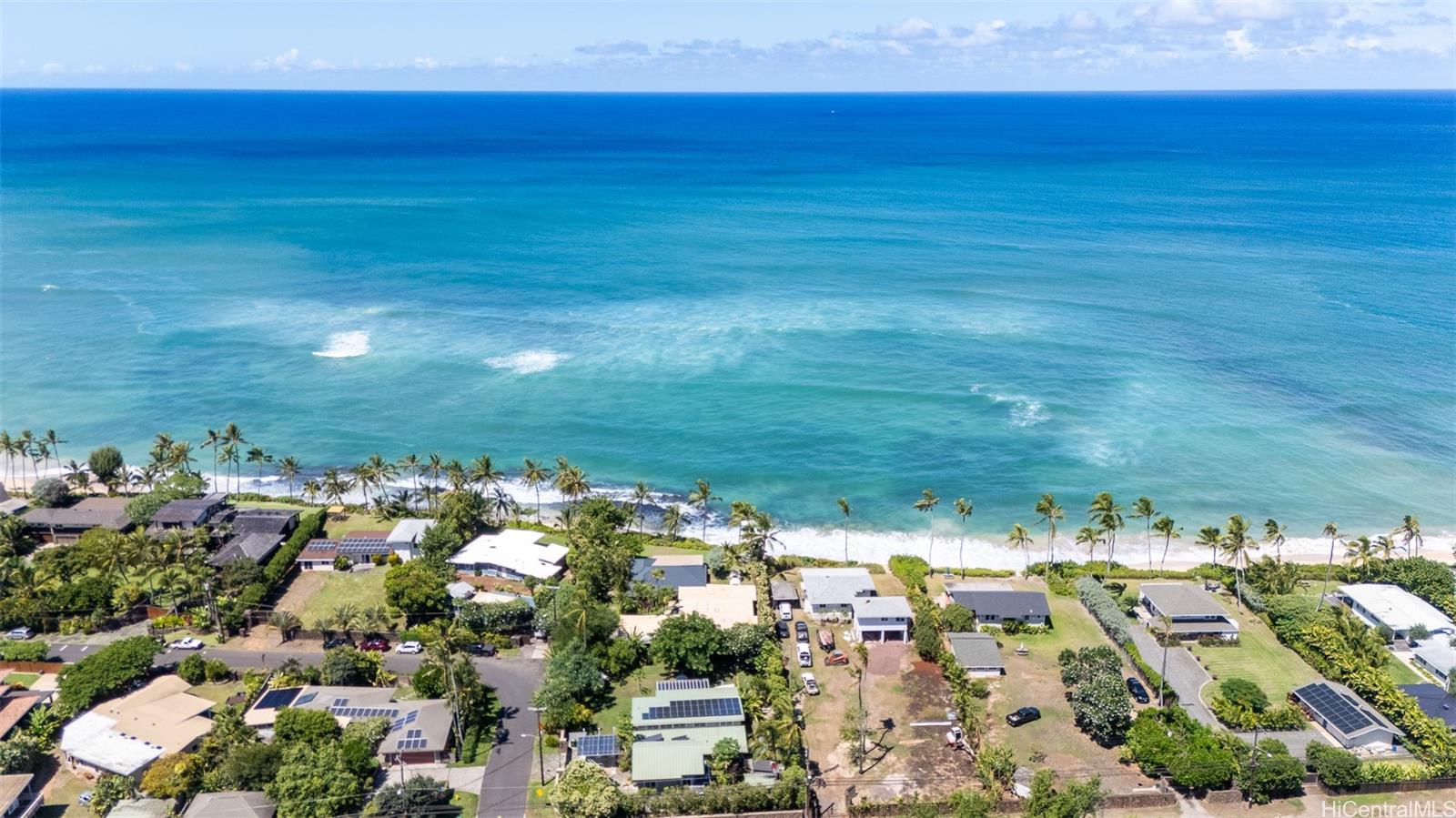 61-707 Papailoa Road Haleiwa, HI 96712 - Photo 6 of 25 A large natural reef outcropping sits just offshore, helping to buffer the property from strong surf and coastal erosion. For much of the year, shifting sands cover the reef, creating an expansive sandy beachfront that changes with the seasons—offering both beauty and a measure of natural protection. North Shore Haleiwa Hawaii.