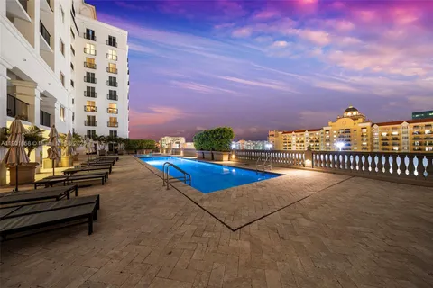 a view of a hallway with seating area