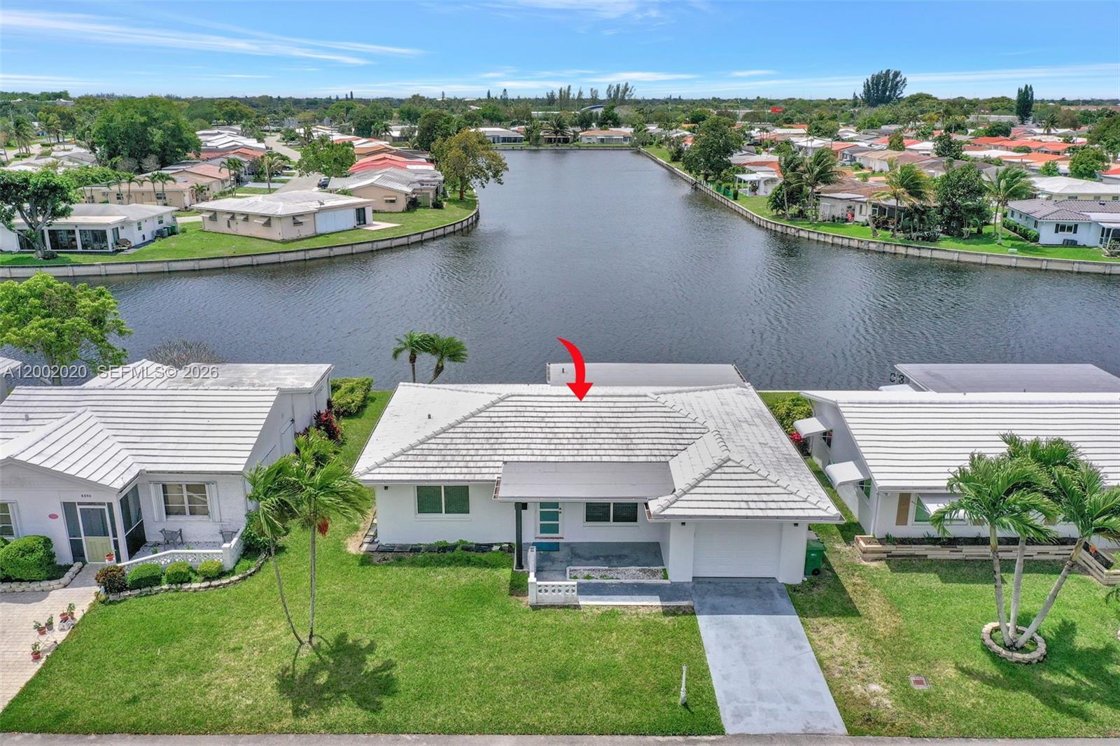 8502 Northwest 59th Street Tamarac, FL 33321 - Photo 1 of 18 an aerial view of a house with a lake view