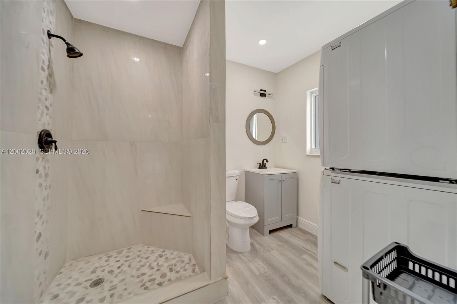 8502 Northwest 59th Street Tamarac, FL 33321 - Photo 13 of 18 a bathroom with a toilet a sink and a shower