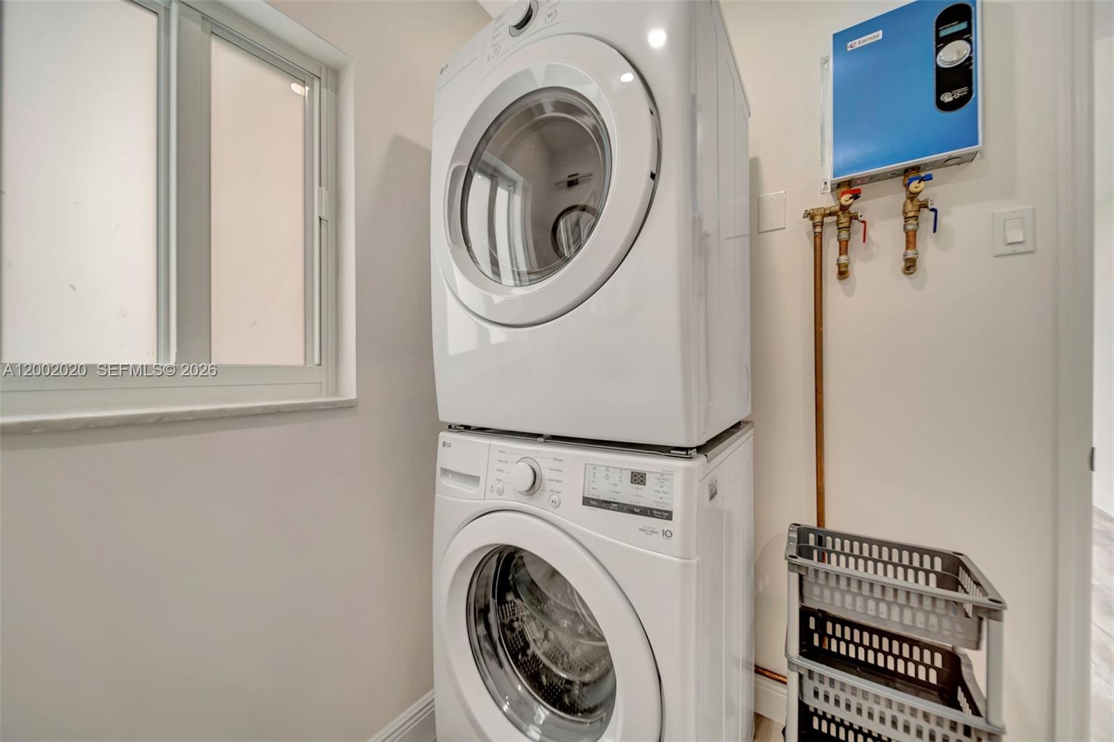 8502 Northwest 59th Street Tamarac, FL 33321 - Photo 14 of 18 a utility room with dryer and washer