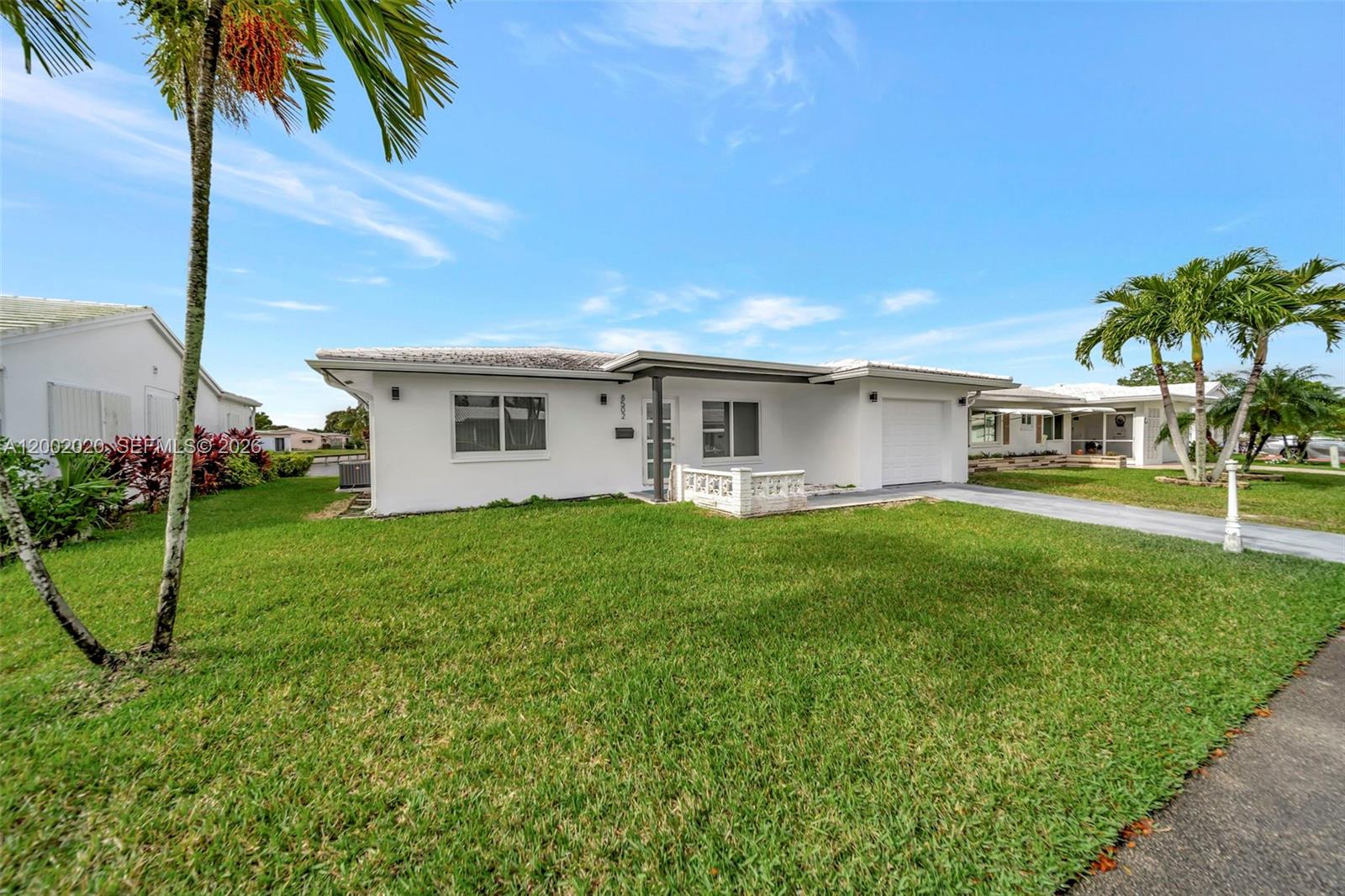 8502 Northwest 59th Street Tamarac, FL 33321 - Photo 3 of 18 a view of a house with a backyard