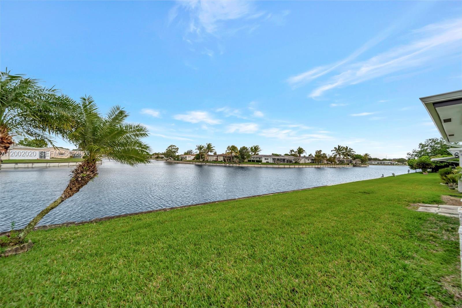 8502 Northwest 59th Street Tamarac, FL 33321 - Photo 4 of 18 a view of a lake from a yard
