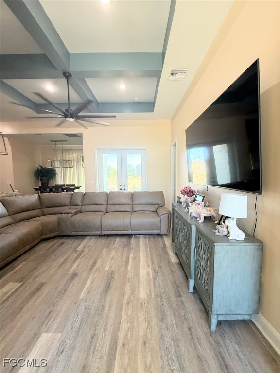 338 Partridge Street Lehigh Acres, FL 33974 - Photo 21 of 30 a living room with furniture and a flat screen tv