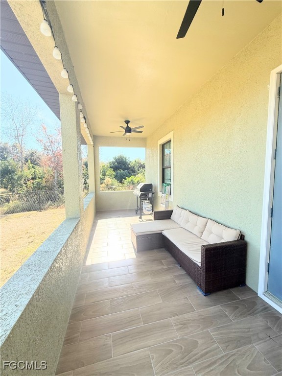 338 Partridge Street Lehigh Acres, FL 33974 - Photo 30 of 30 a living room with furniture and a large window