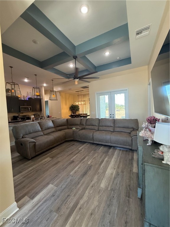 338 Partridge Street Lehigh Acres, FL 33974 - Photo 9 of 30 a living room with furniture and a wooden floor