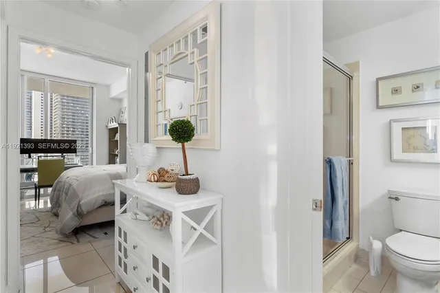 a living room with furniture and a large mirror