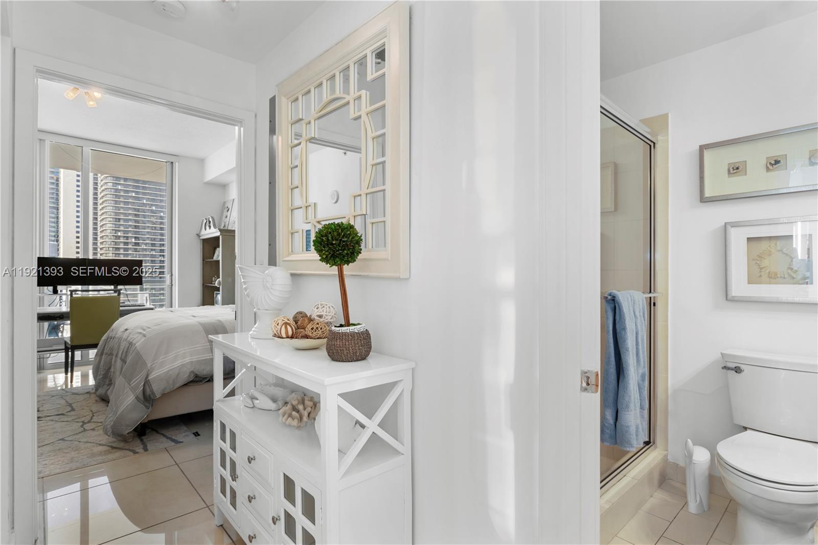 1111 Southwest 1st Avenue, Unit 2925N Miami, FL 33130 - Photo 11 of 19 a living room with furniture and a large mirror