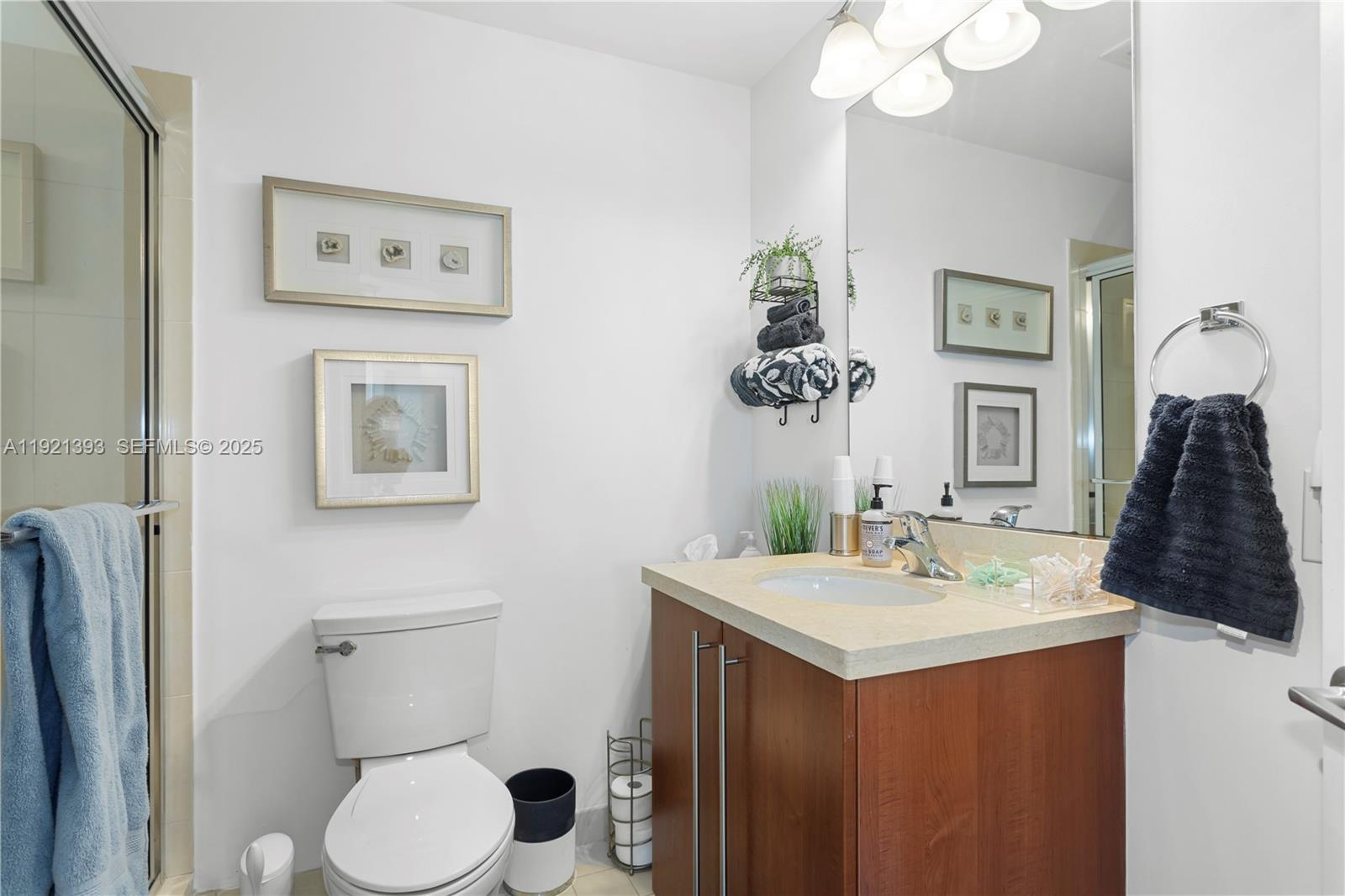 1111 Southwest 1st Avenue, Unit 2925N Miami, FL 33130 - Photo 12 of 19 a bathroom with a sink vanity and toilet