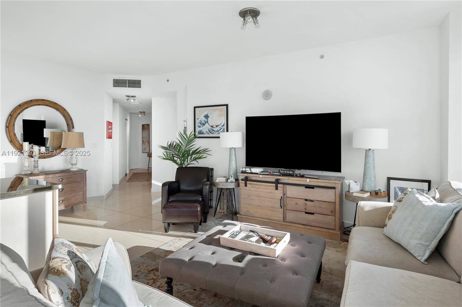 1111 Southwest 1st Avenue, Unit 2925N Miami, FL 33130 - Photo 7 of 19 a living room with furniture and a flat screen tv