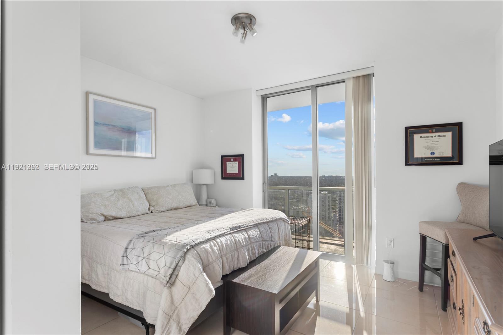 1111 Southwest 1st Avenue, Unit 2925N Miami, FL 33130 - Photo 8 of 19 a bedroom with a bed and a window