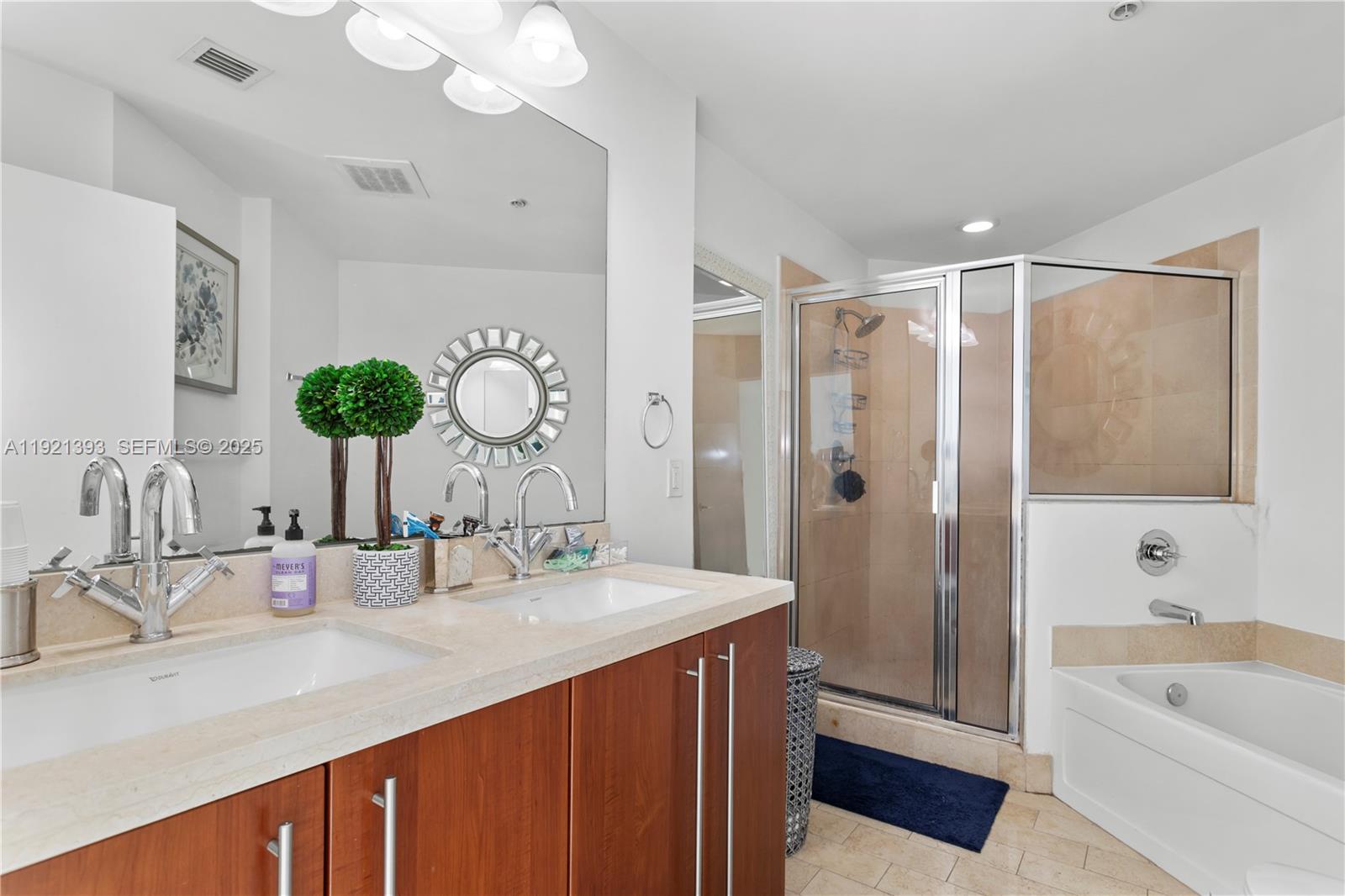 1111 Southwest 1st Avenue, Unit 2925N Miami, FL 33130 - Photo 9 of 19 a bathroom with a double vanity sink mirror and shower