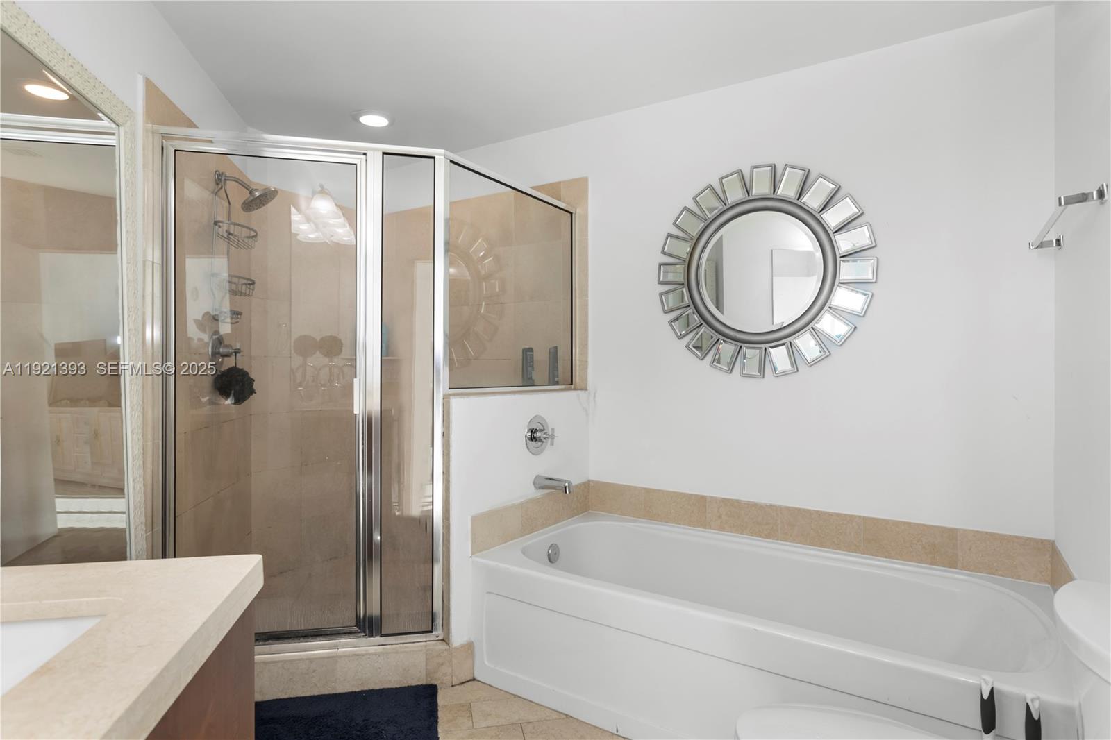 1111 Southwest 1st Avenue, Unit 2925N Miami, FL 33130 - Photo 10 of 19 a bathroom with a bathtub a window and a chandelier