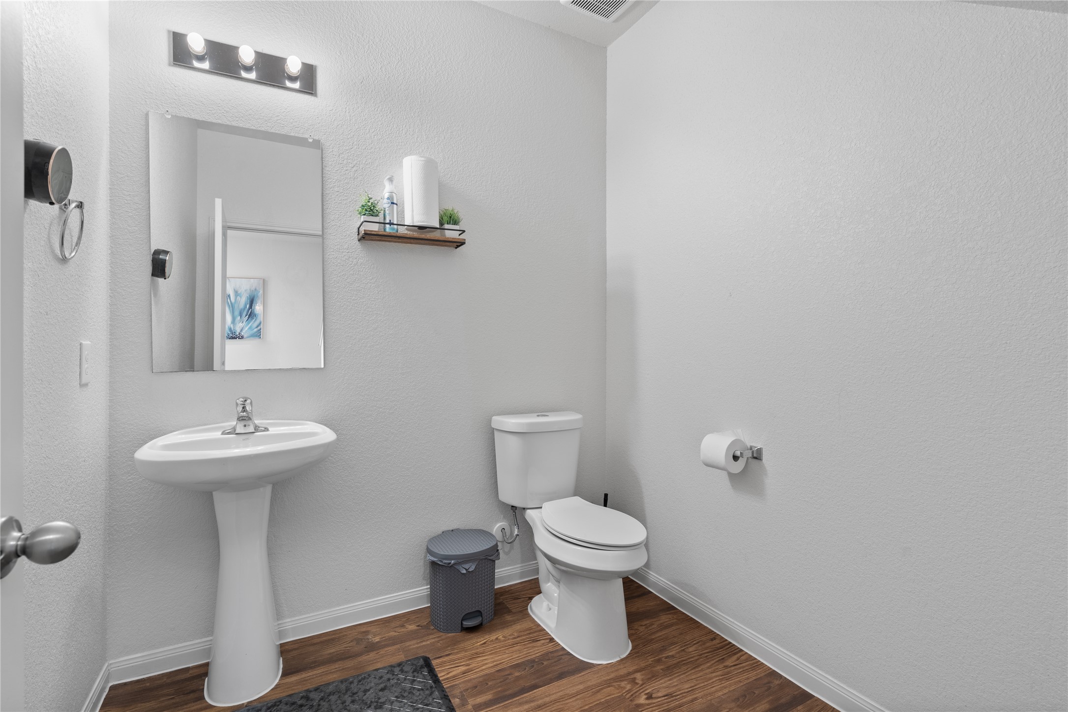 20205 Grover Cleveland Way Manor, TX 78653 - Photo 14 of 26 a bathroom with a sink toilet and a mirror