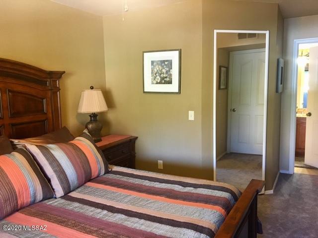 5751 North Kolb Road, Unit 36203 Tucson, AZ 85750 - Photo 13 of 25 a bedroom with bed and a lamp