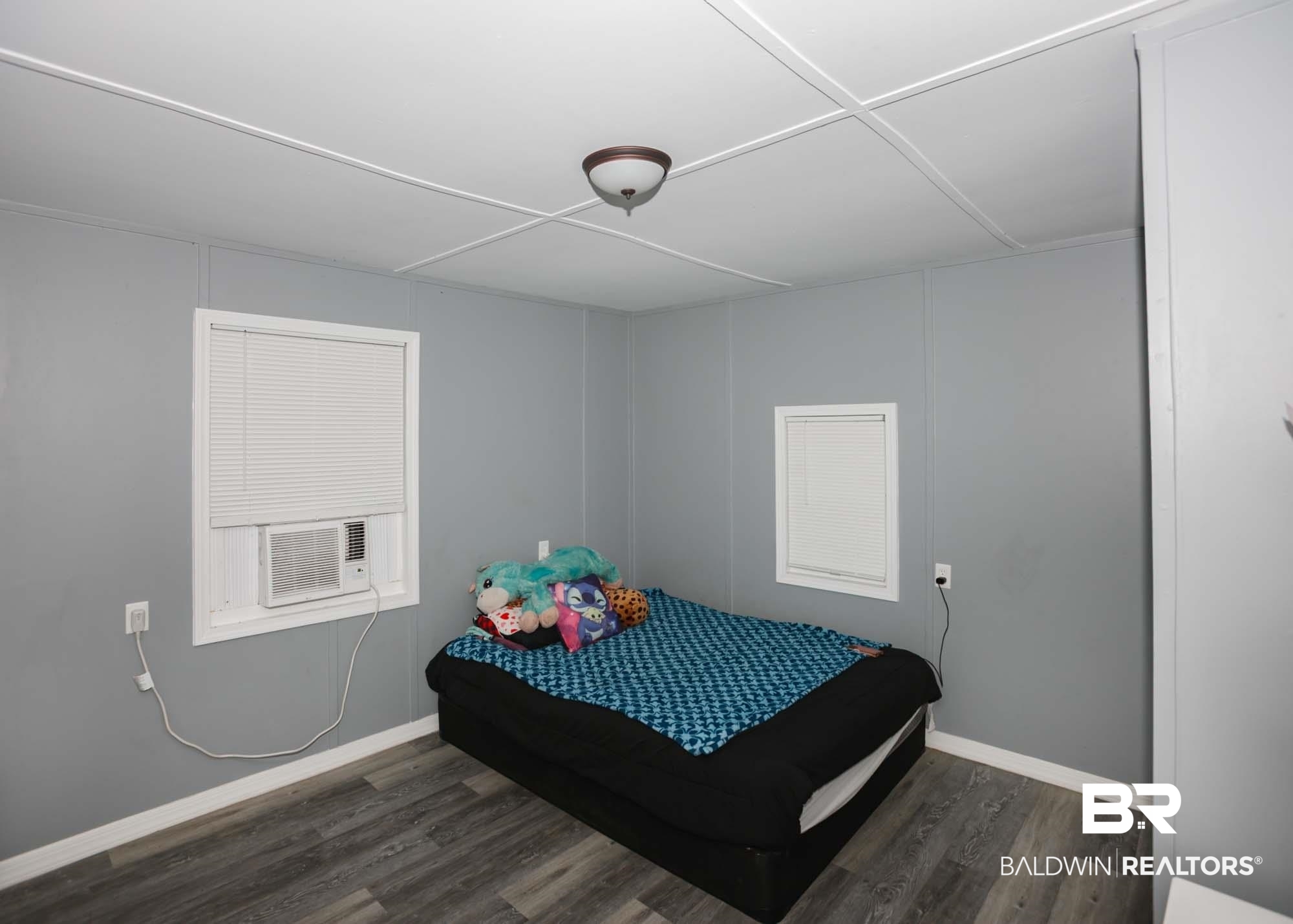 11998 Workman Avenue Foley, AL 36535 - Photo 30 of 59 Bedroom with wood finished floors and cooling unit