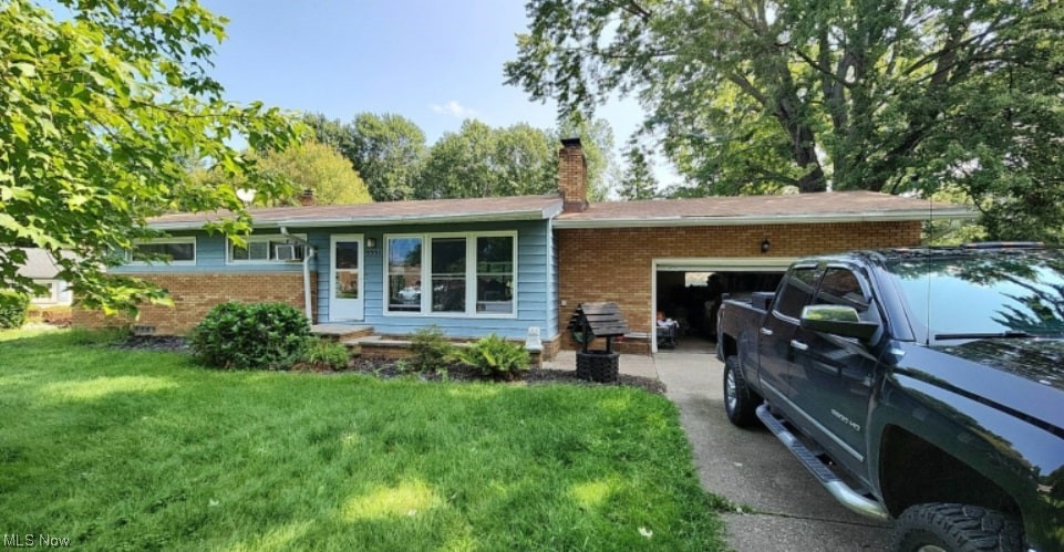 5551 Meister Road Mentor, OH 44060 - Photo 1 of 1 View of front of house with a garage and a front yard
