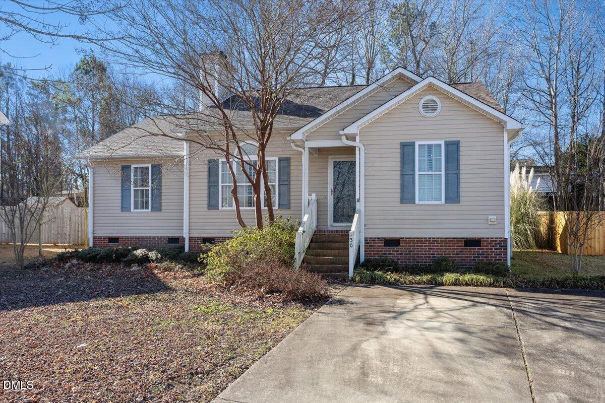 130 Muirfield Ridge Drive Garner, NC 27529 - Photo 1 of 29 a front view of a house with a yard