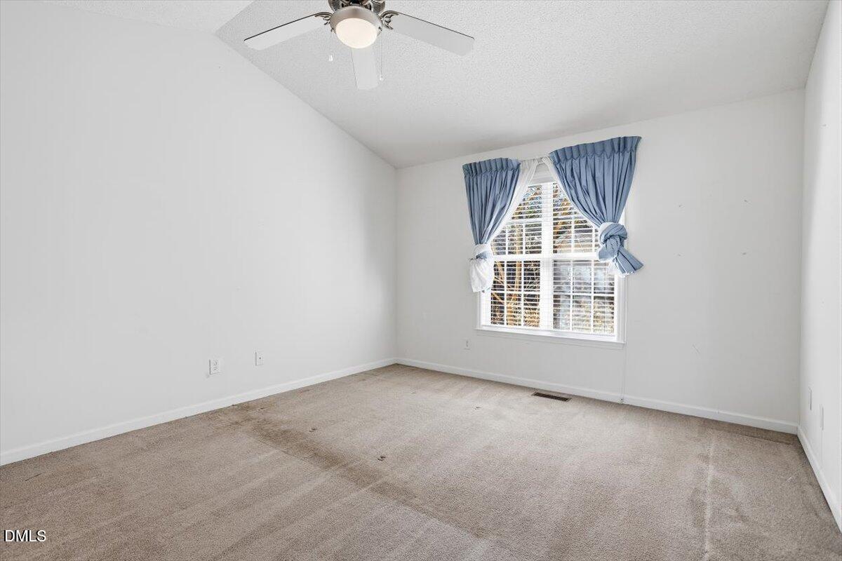 130 Muirfield Ridge Drive Garner, NC 27529 - Photo 12 of 29 an empty room with windows