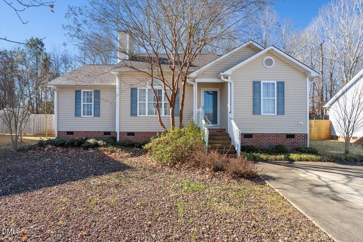 130 Muirfield Ridge Drive Garner, NC 27529 - Photo 26 of 29 a front view of a house with a yard